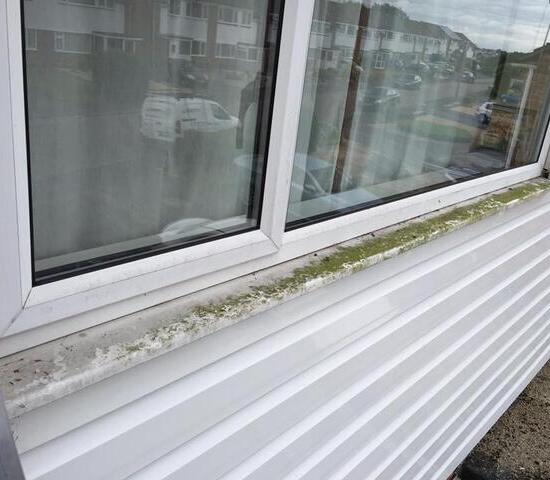 dirt and stains on window frame and sill